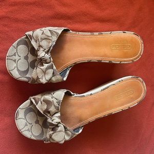 Coach 11 M Signature 3 1/4” wedge sandal. Cloth bow leather insole.